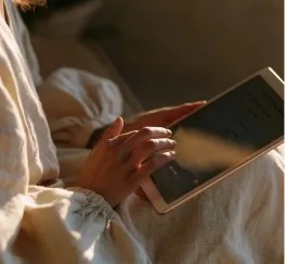 Hands holding a tablet
